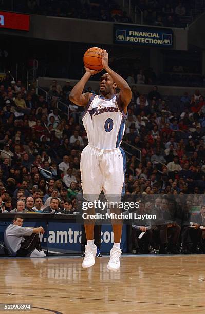 Gilbert Arenas of the Washington Wizards shoots against the Phoenix Suns during the game on January 15, 2005 at the MCI Center in Washington, DC. The...