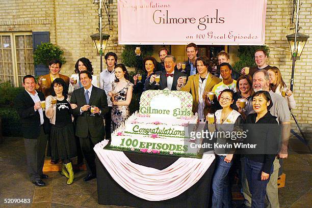 The WB's David Janollari creator/producer, Amy Sherman-Palladino and WB's Peter Roth pose with the cast at The WB Networks "The Gilmore Girls" 100th...