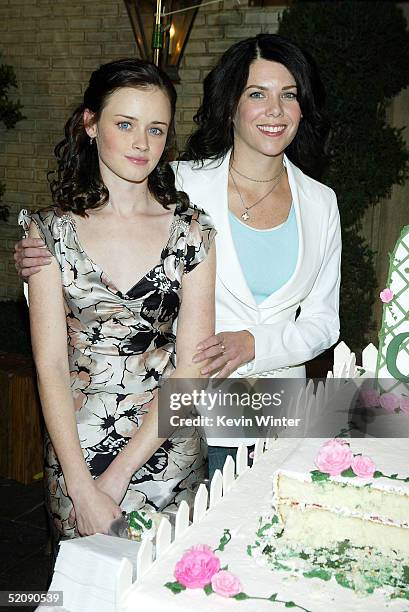 Actors Alexis Bledel and Lauren Graham pose at The WB Networks "The Gilmore Girls" 100th episode celebration on the set at Warner Bros. Studios on...