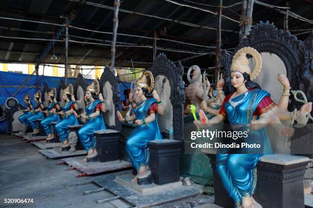 idol of goddess durga at workshop for dassera festival, mumbai, maharashtra, india - saraswati puja stock pictures, royalty-free photos & images