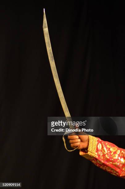 male stage artist gripping sword in hand, jodhpur, rajasthan, india, asia - holding sword stock pictures, royalty-free photos & images