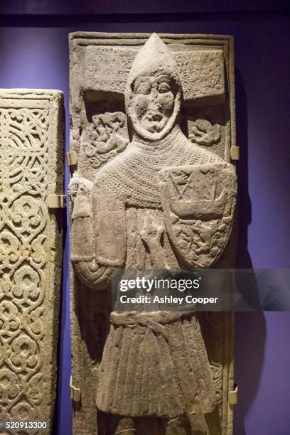 an ancient preserved grave slab in iona abbey on iona, off mull, scotland, uk. - abby stock pictures, royalty-free photos & images