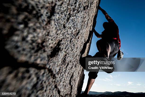 rock climbing in a dramtic setting - soloing stock pictures, royalty-free photos & images