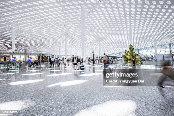 modern airport - airport corridor stock pictures, royalty-free photos & images