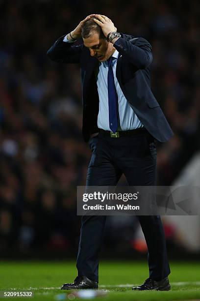 Slaven Bilic, manager of West Ham United reacts during The Emirates FA Cup, sixth round replay between West Ham United and Manchester United at the...