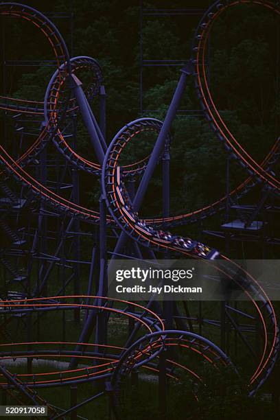 roller coaster at night - empty roller coaster stock pictures, royalty-free photos & images