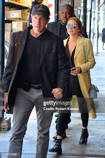 Lindsay Lohan and her father Michael Lohan were seen out in SoHo on April 13, 2016 in New York City.