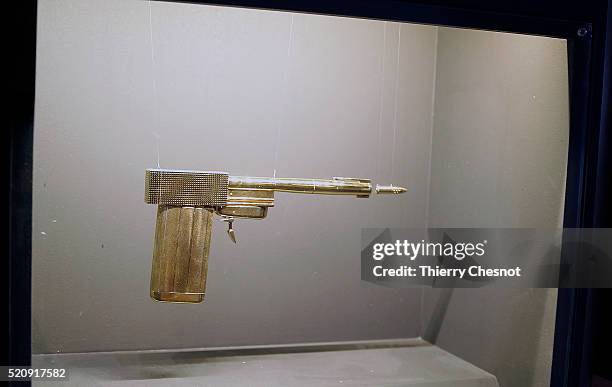 Gold gun from the James Bond film "The Man with the Golden Gun" is displayed as part of an exhibition dedicated to James Bond 007 "The Designing 007:...