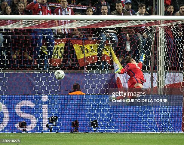 Barcelona's German goalkeeper Marc-Andre Ter Stegen lets through a gola by Atletico Madrid's French forward Antoine Griezmann during the Champions...