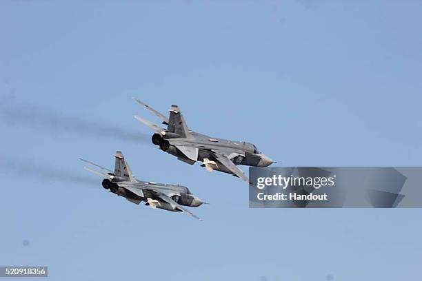 In this handout photo provided by the U.S. Navy, Two Russian Sukhoi Su-24 attack aircraft fly over USS Donald Cook on April 12, 2016 in the Baltic...