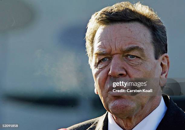 German Chancellor Gerhard Schroeder is seen as a banner carrying the Albert Einstein quote "...the state is for people and not people for the state"...