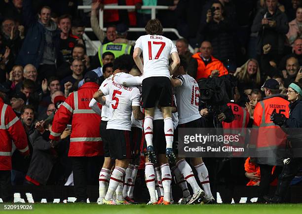 Marouane Fellaini of Manchester United celebrates scoring his team's second goal with team mates during The Emirates FA Cup, sixth round replay...