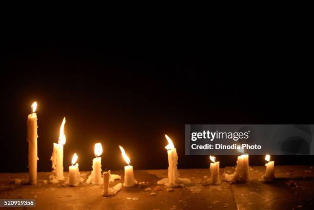 candles of wax illuminated for festival masunda tank thane maharashtra - shrine candles stock pictures, royalty-free photos & images