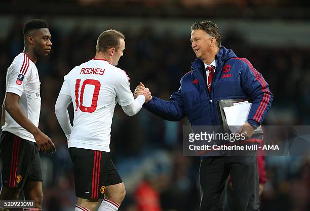 Louis van Gaal Manager of Manchester United shakes hands with Wayne Rooney of Manchester United after the Emirates FA Cup Sixth Round Replay match...
