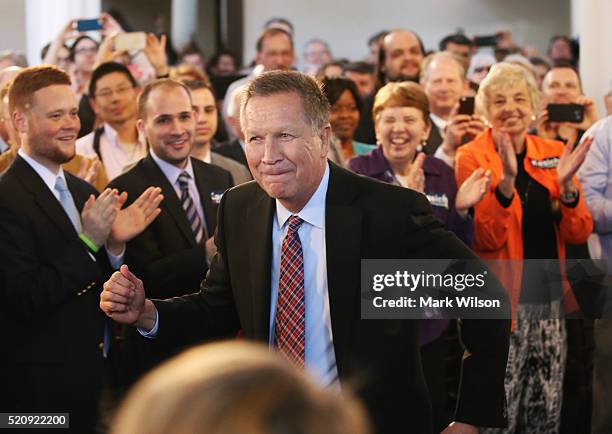 Republican presidential candidate Gov. John Kasich dances to the music being played during a town hall style campaign stop at the Historic Savage...