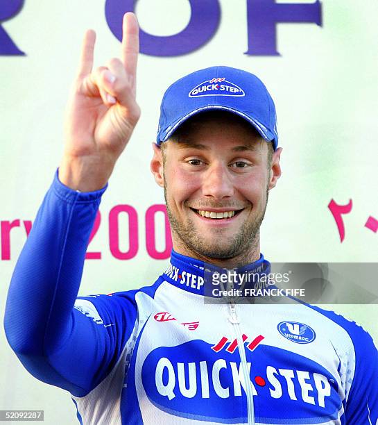 Belgian Tom Boonen celebrates on the podium at the end of the second stage of the Tour of Qatar cycling race between Camel Race Track and Qatar...