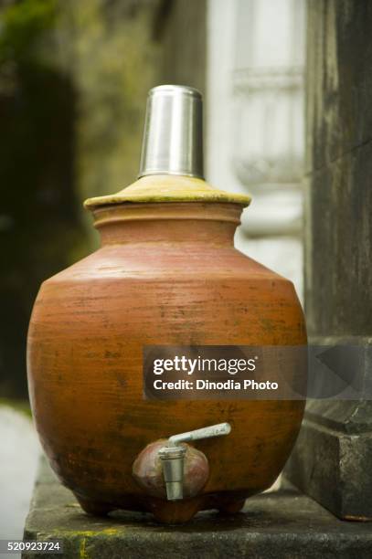 earthen pot with steel glass in mumbai at maharashtra, india - tongeschirr stock-fotos und bilder