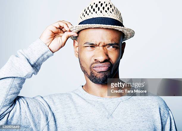 man looking annoyed - sour faced stock pictures, royalty-free photos & images