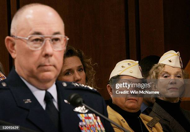 Members of the Gold Star Wives, an organization comprised of military widows, listen to a Senate Armed Services Committee hearing regarding death...