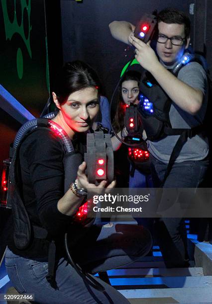 Players aim with laser guns in a games centre 'Laser Game Evolution' on April 13, 2016 in Bretigny-sur-Orge, France. Laser Game Evolution, the French...