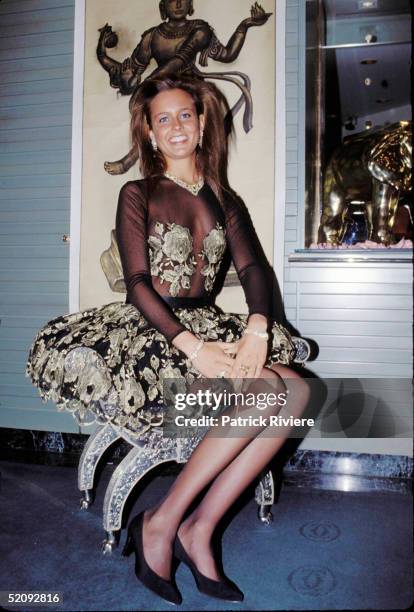 Deborah McMahon wears a Jill Fitzsimon's gold lace and black chiffon evening dress and shows off some of the prize pieces in the $7 million Cartier...