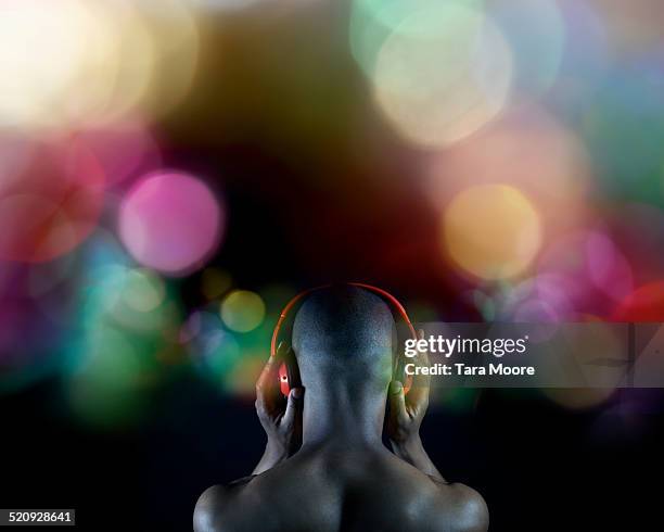 man listening to music with headphones - audio visual stock pictures, royalty-free photos & images