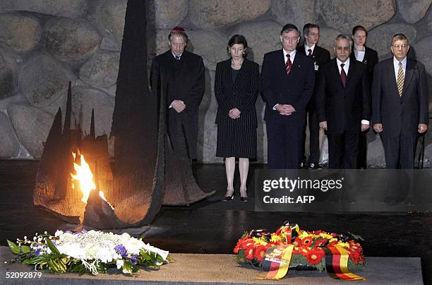 German President Horst Koehler , his wife Eva and his Israeli counterpart Moshe Katzav stand next to unidentified officials after Koehler laid a...