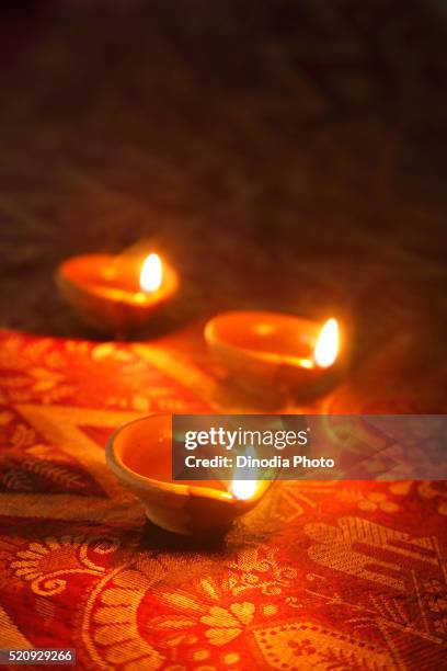 earthen oil lamps diya on diwali deepawali festival - diya oil lamp fotografías e imágenes de stock
