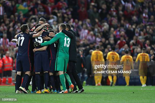 Atletico Madrid's players celebrate their win during the Champions League quarter-final second leg football match Club Atletico de Madrid VS FC...