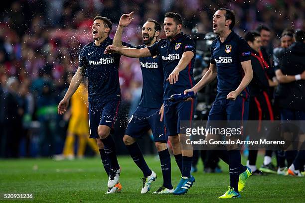 Diego Godin , Koke Juan Francisco Torres alias Juanfran and Lucas Hernandez Pi of Atletico de Madrid celebrate their victory with teammates after...