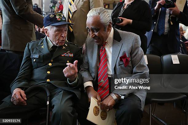 Rep. Charles Rangel listens to retired U.S. Army Col. John Palese prior to a Congressional Gold Medal ceremony April 13, 2016 on Capitol Hill in...