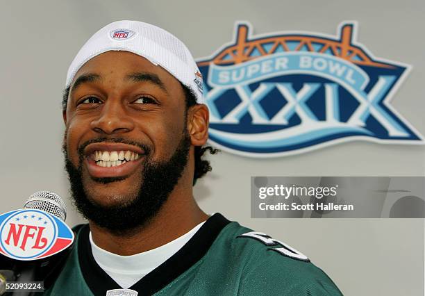 Donovan McNabb, quarterback of the Philadelphia Eagles greets the media at media day prior to the start of Super Bowl XXXIX at Alltel Stadium on...