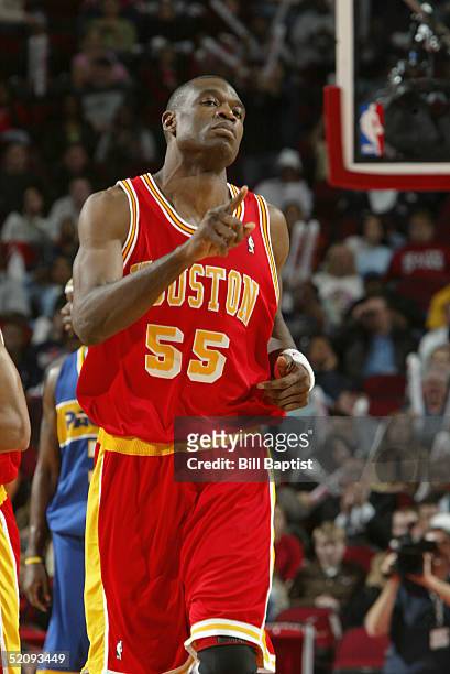 Dikembe Mutombo of the Houston Rockets stands on the court during the game with the Indiana Pacers on January 18, 2005 at the Toyota Center in...