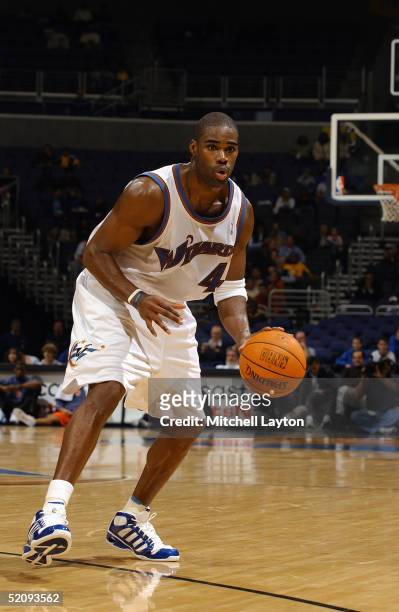 Antawn Jamison of the Washington Wizards dribbles the ball against the Charlotte Bobcats during the preseason game at MCI Center on October 24, 2004...