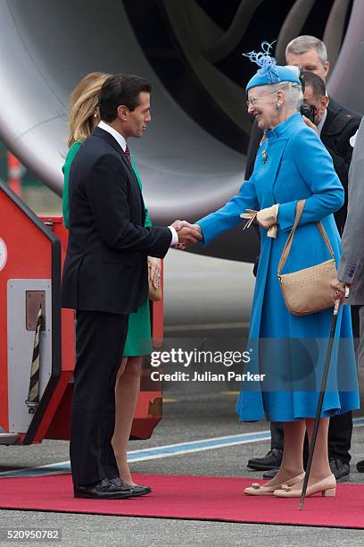 The President, and his wife arrive at Copenhagen Airport at the start on their visit, and greeted by Queen Margrethe of Denmark, during the State...