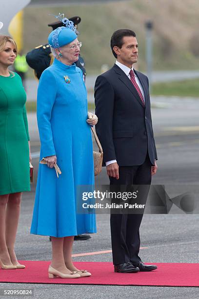 The President, and his wife arrive at Copenhagen Airport at the start on their visit, and greeted by Queen Margrethe of Denmark, during the State...