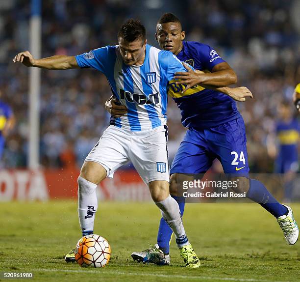 Ivan Pillud of Racing Club fights for the ball with Frank Fabra of Boca Juniors during a match between Racing and Boca Juniors as part of Copa...