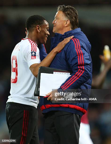 Louis van Gaal Manager of Manchester United and Anthony Martial of Manchester United during the Emirates FA Cup Sixth Round Replay match between West...