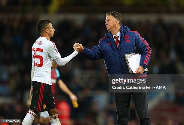 Louis van Gaal Manager of Manchester United and Jesse Lingard of Manchester United after the Emirates FA Cup Sixth Round Replay match between West...