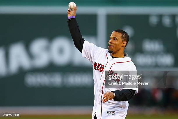 Charlie Davies of the New England Revolution throws out the first pitch before the game between the Boston Red Sox and the Baltimore Orioles at...