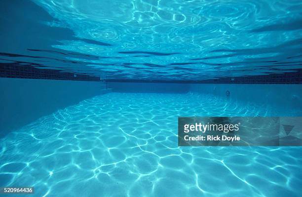 rippling water in swimming pool - underwater ストックフォトと画像