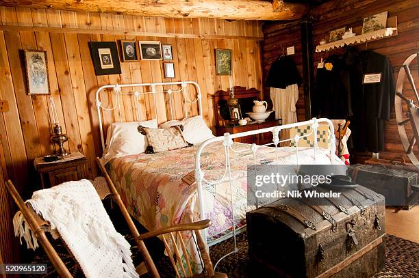 Log cabin room furnished in turn of the century furniture is one of the historic buildings that form the Shafer Historical Museum which exhibits...