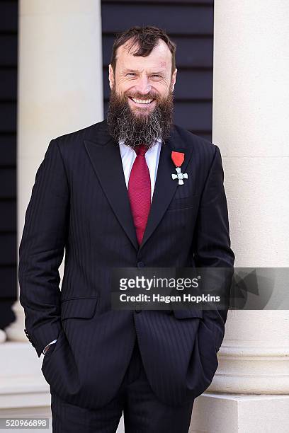 Bruce Anstey poses after receiving the insignia of a Member of the New Zealand Order of Merit, for services to motorsport during an investiture...