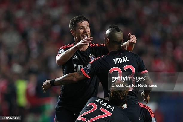 Bayern Munich's midfielder Xabi Alonso and Bayern Munich's defender Arturo Vidal celebrates Bayern«s first goal score by Bayern Munich's defender...