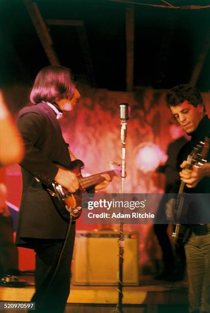 John Cale and Lou Reed of the Velvet Underground perform on stage at the Cafe Bizarre, New York, December 1965.