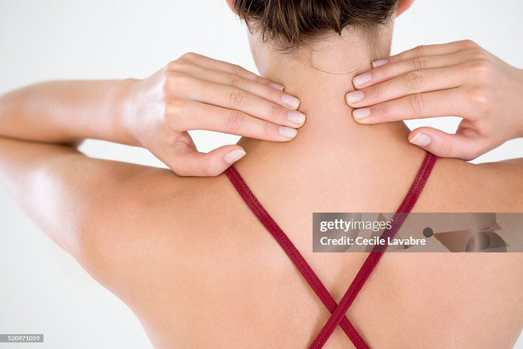 Close-up hands massaging neck