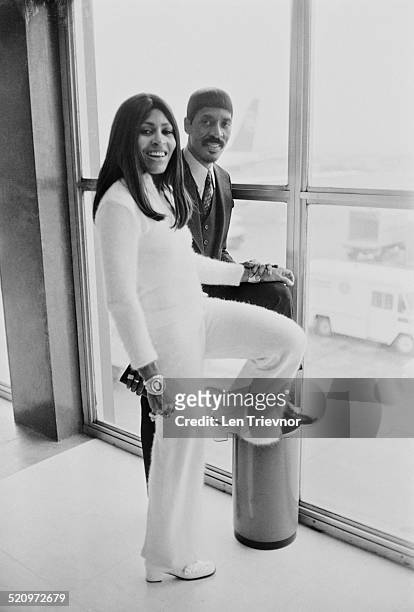 American musician Ike Turner and his wife, singer, dancer, and actress Tina Turner at London Airport on their way to Los Angeles, London, 11th March...