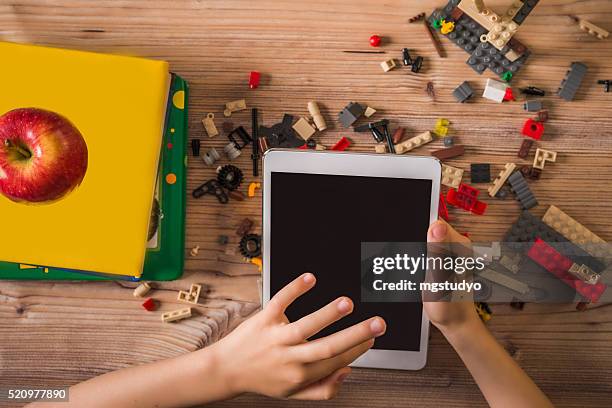 child play digital tablet at school - building lego stock pictures, royalty-free photos & images