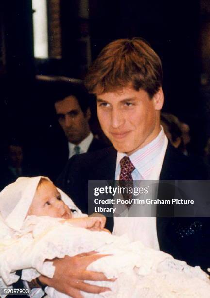 Prince William Holding His Godson, Konstantine Alexios, At The Baby's Christening At The Greek Cathedral Of Sophia In London.