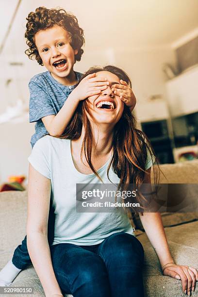 playful family - kid hide and seek stock pictures, royalty-free photos & images